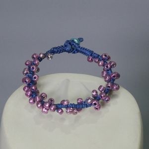 Handmade blue and purple chord and bead bracelet